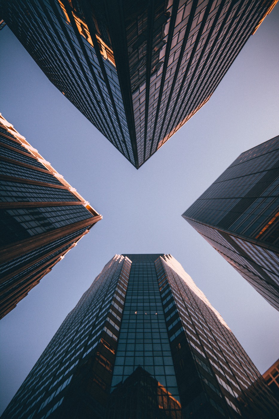 Looking up at converging towers